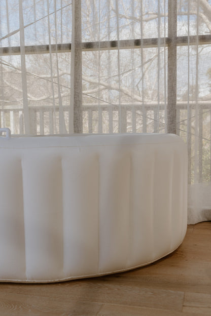 Hire birth pool set up by a sunny window at home, soft-sided inflatable pool for a water birth in NZ