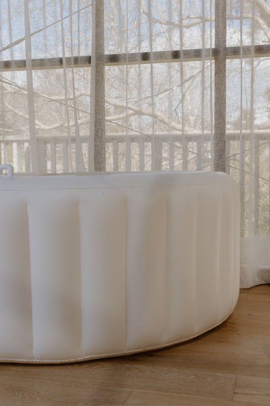 Hire birth pool set up by a sunny window at home, soft-sided inflatable pool for a water birth in NZ