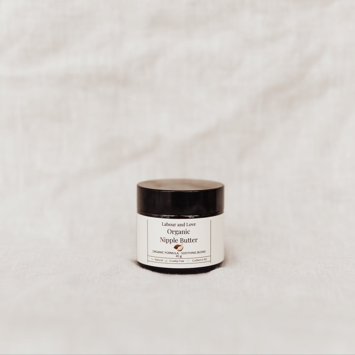 Jar of Nipple Butter on a light gray background