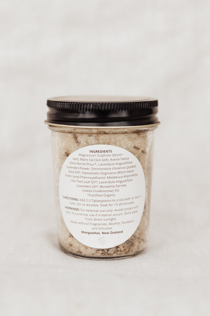 Jar of bath salts with a label on a white background