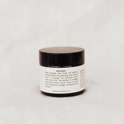 Small jar with a black lid on a white background