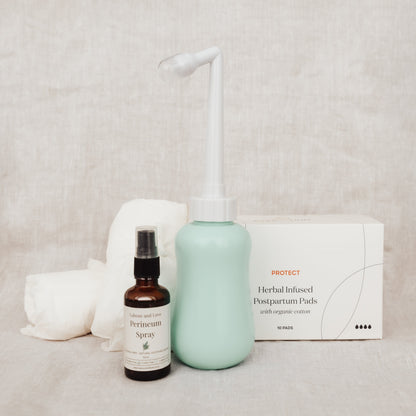 Perineum spray, Organic Cotton Postpartum Undies, and Organic Postpartum Pads, and Peri Bottle on a neutral background