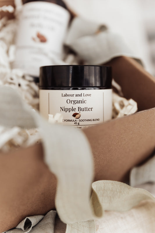 Jar of Labour and Love Organic Nipple Butter on a textured surface
