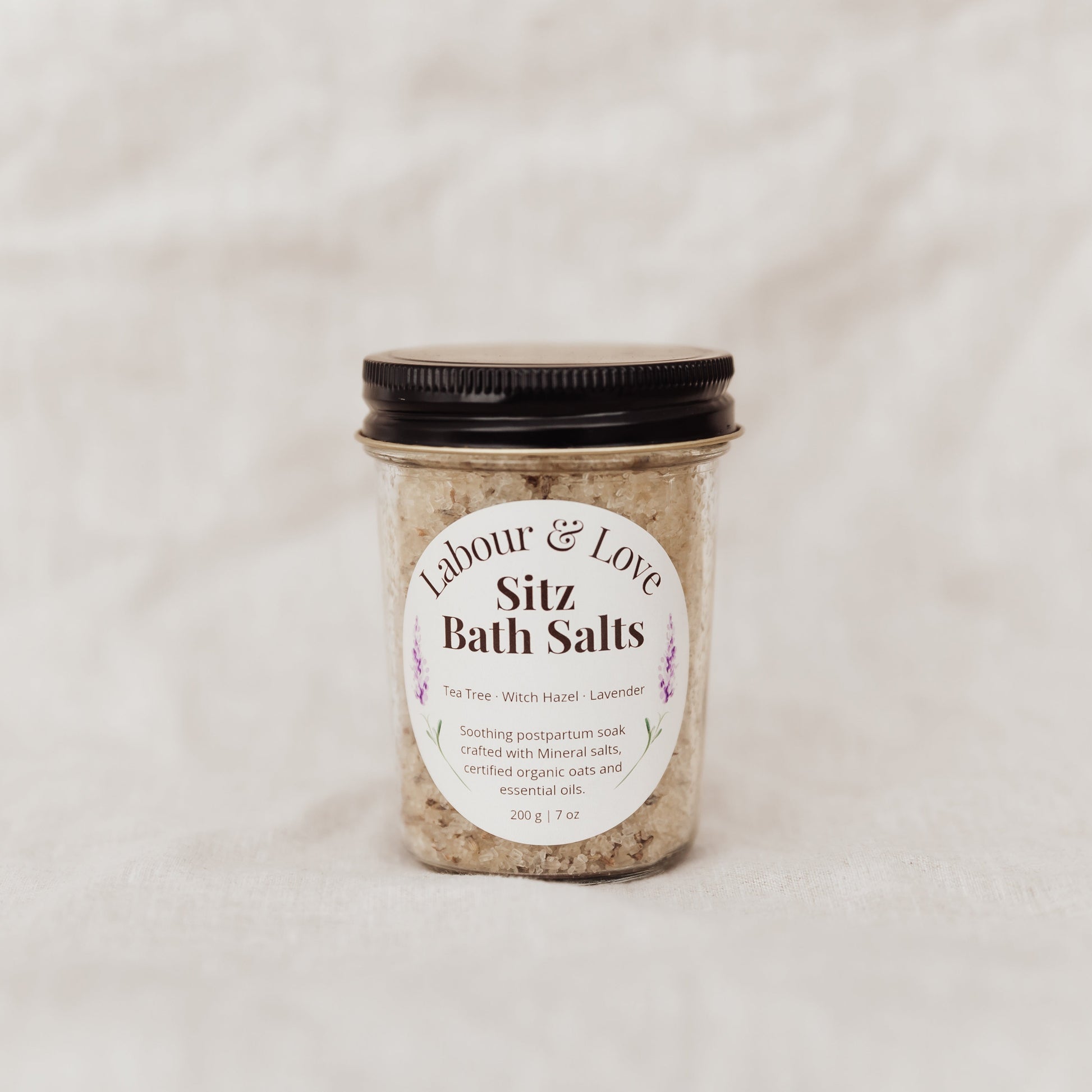 Jar of Lavender 'Labour & Love Sitz Bath Salts' on a light background