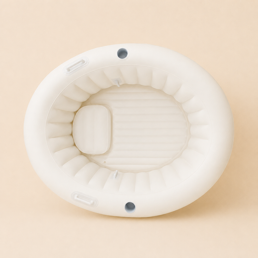 Overhead view of the Labour & Love Natural Cream birth pool showing the spacious interior, padded headrest and grab handles